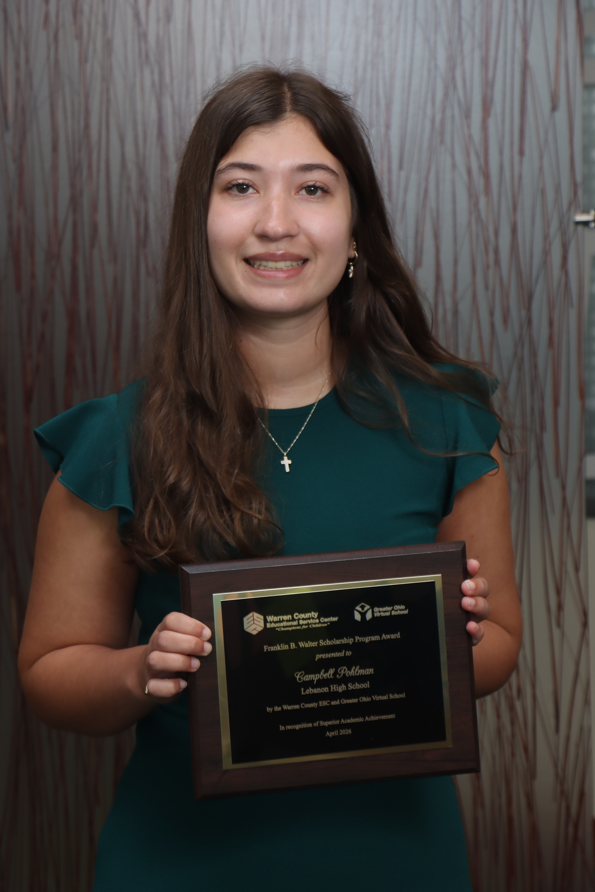 Campbell Pohlman poses with her award